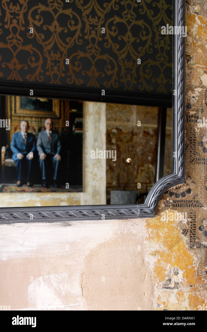 Rough Luxe, London, United Kingdom. Architect: Rabih Hage, 2008. Mirror in entrance hall. Stock Photo