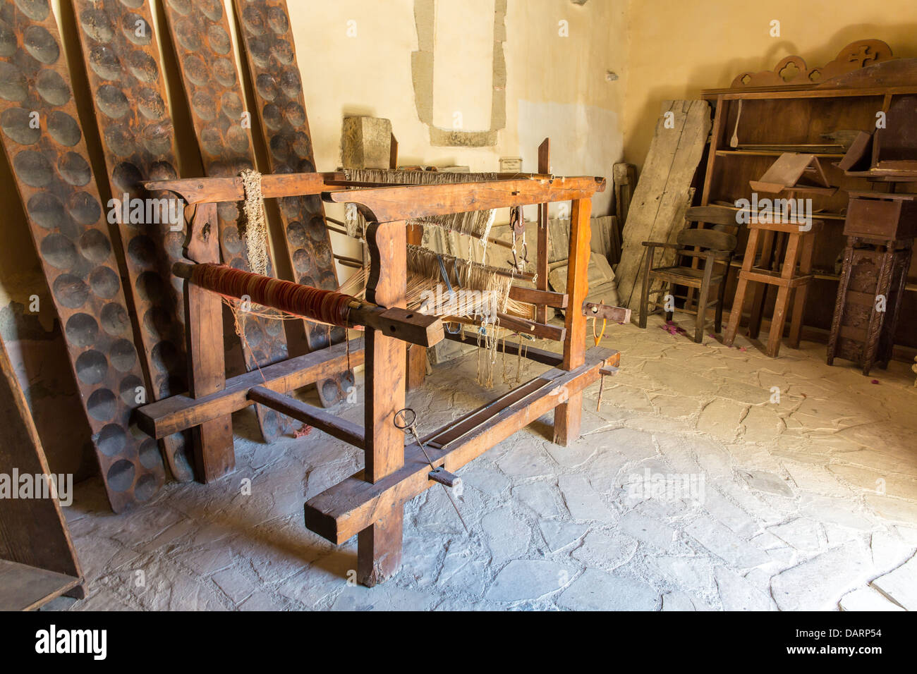 Loom with threads in Museum with artifacts of ancient Greek in monastery in Messara Valley Crete, Greece Stock Photo