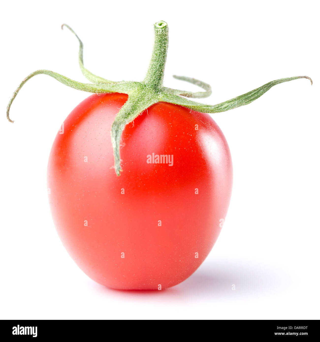 a tomato with green isolated before white background Stock Photo - Alamy