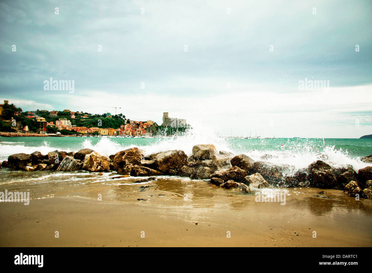 Lerici in Liguria with waves crashing on rocks Stock Photo