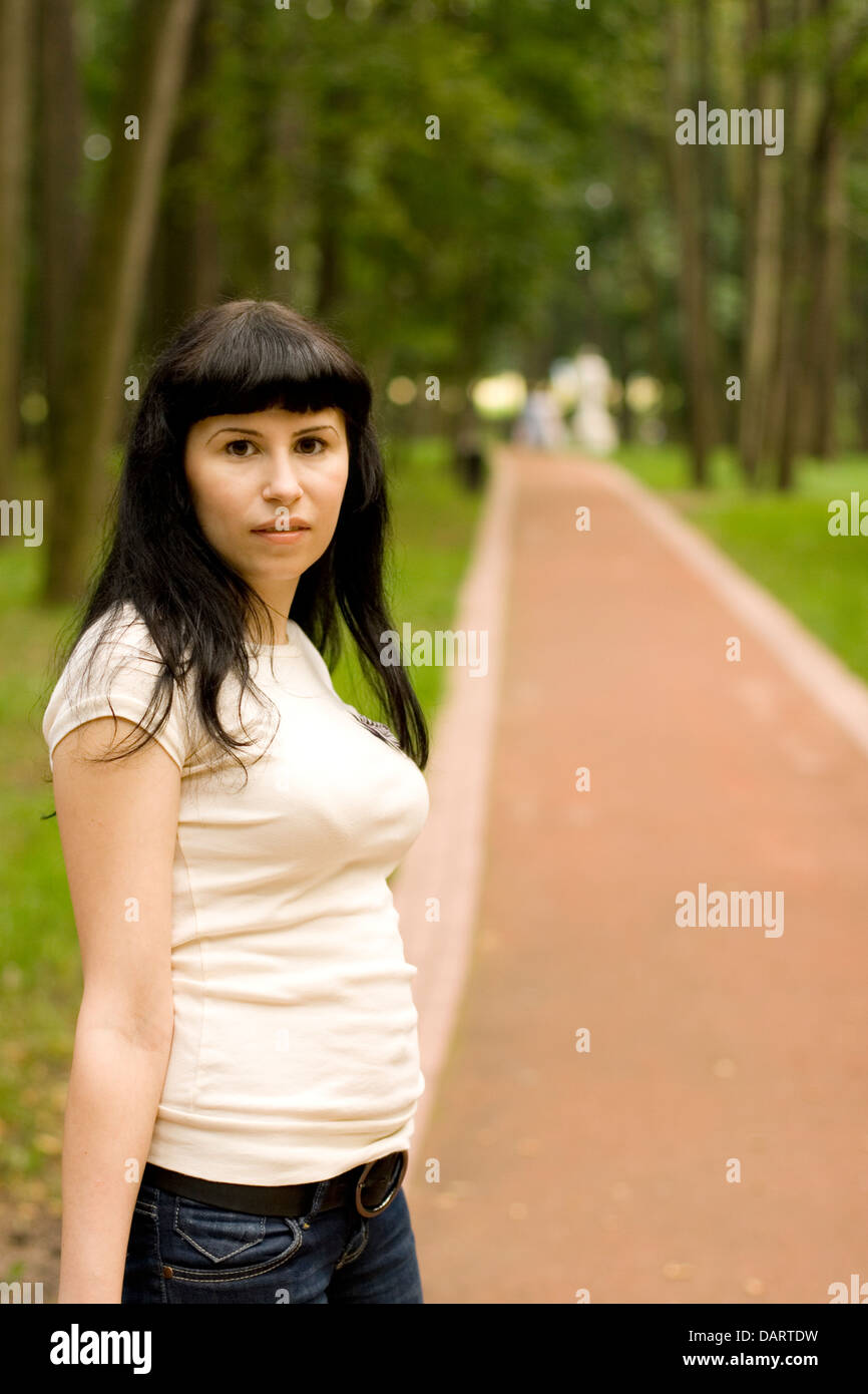 Alone girl walking on road hi-res stock photography and images - Alamy