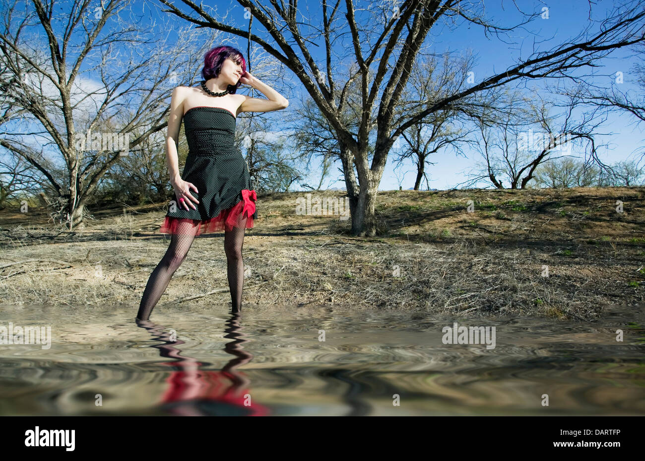 Woman in dress wading in water hi-res stock photography and images - Alamy