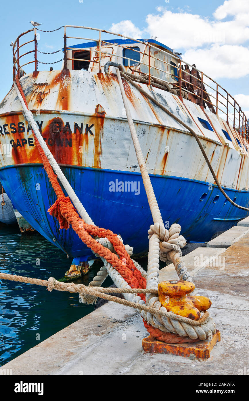 ropes and rusty detail of ship in harbour of Hout Bay, Cape Town