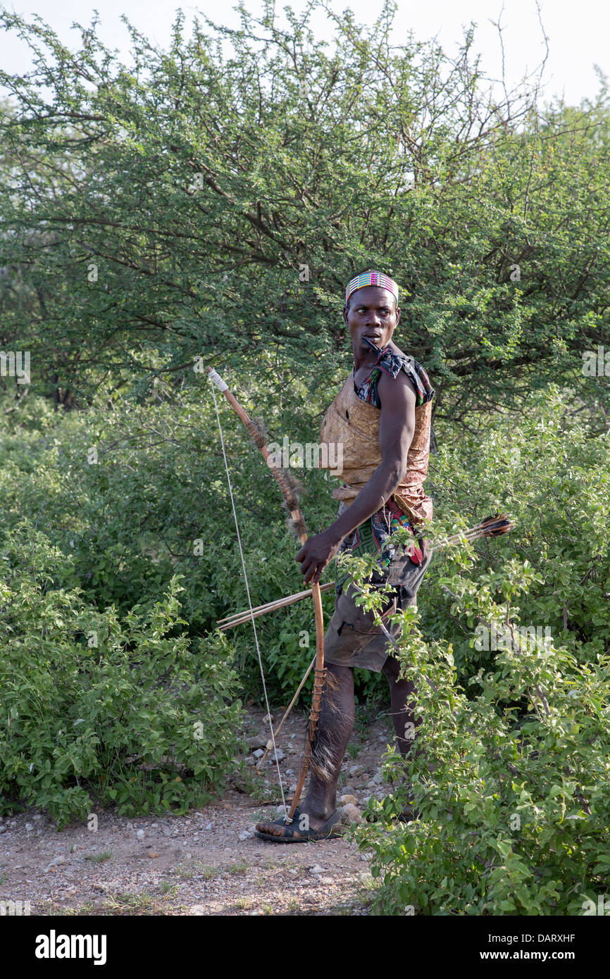 Africa, Tanzania. A Hadzabe hunter hunts with a bow and poisoned arrows