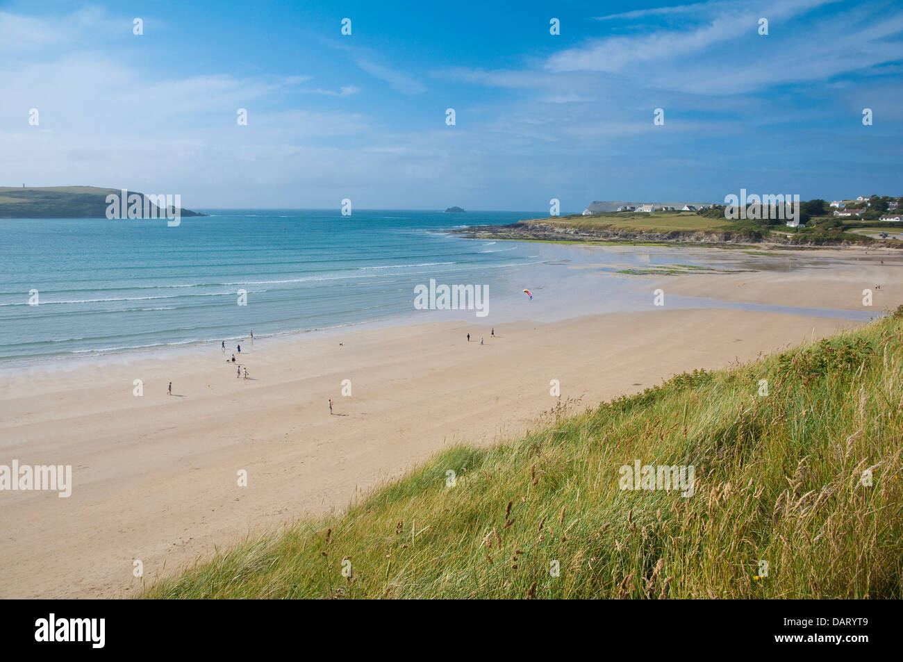 Daymer Bay, sandy beach with the lower slope of the grassy Brea Hill as foreground. Camel Estuary, Cornwall, England, UK. Stock Photo