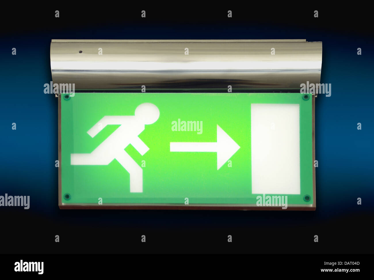 Emergency exit sign glowing green Stock Photo