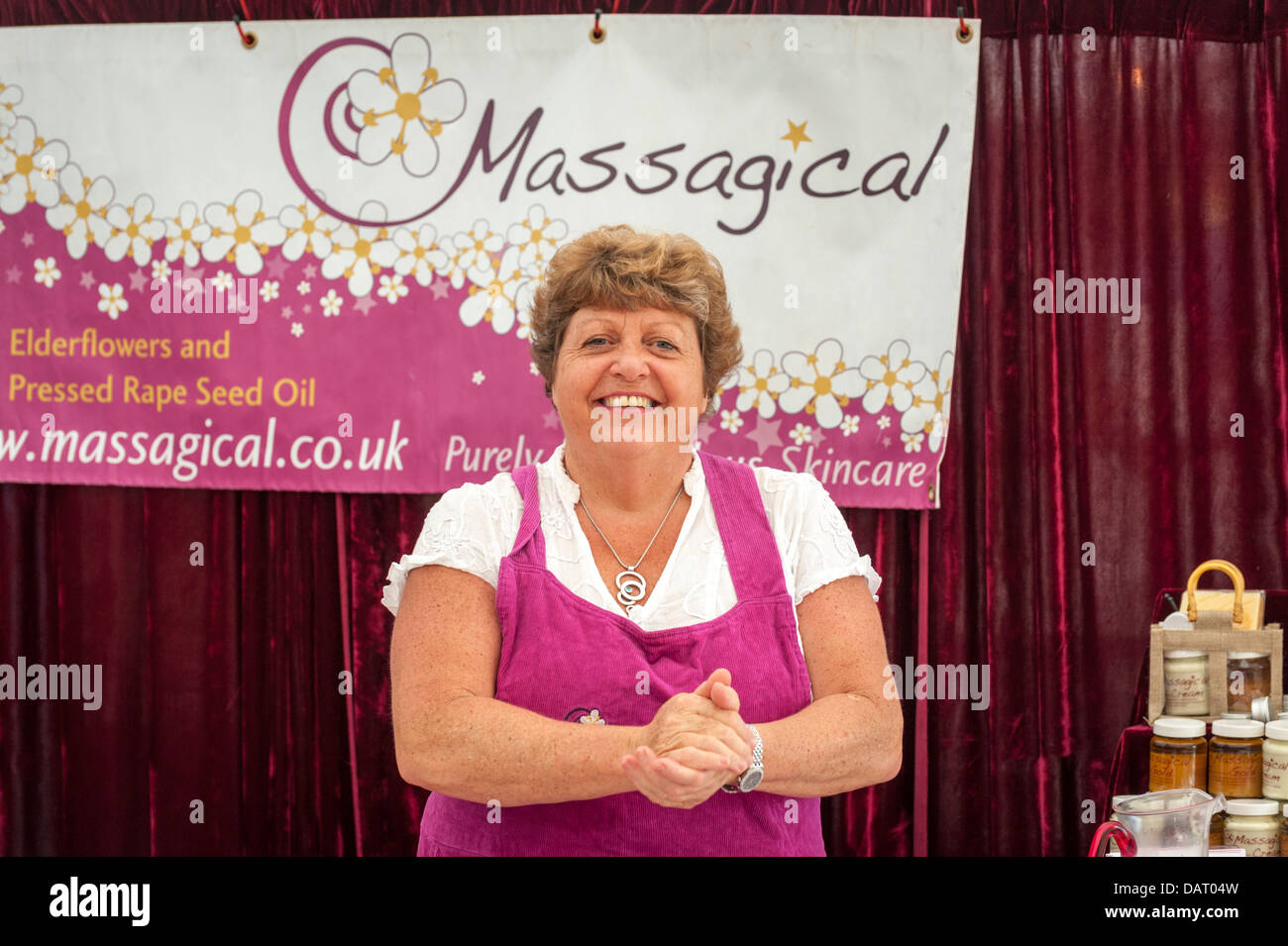 The stallholder at the Massagical massage products stall at Blenheim Palace Flower Show UK Stock Photo