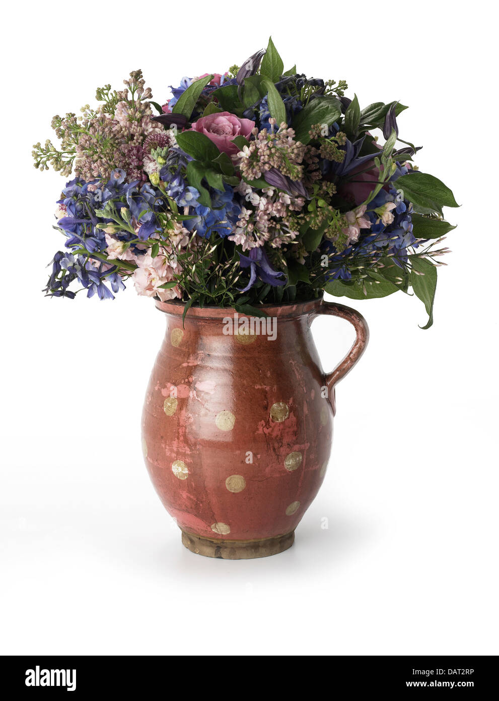 Bouquet of flowers in brown jug Stock Photo