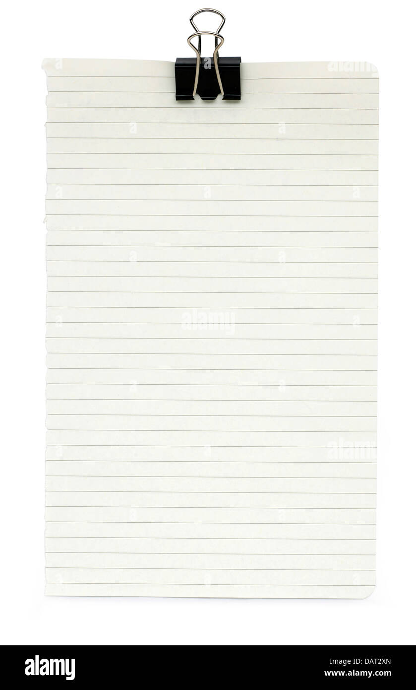 sheet of blank lined notepaper and bulldog clip cut out onto a white background Stock Photo