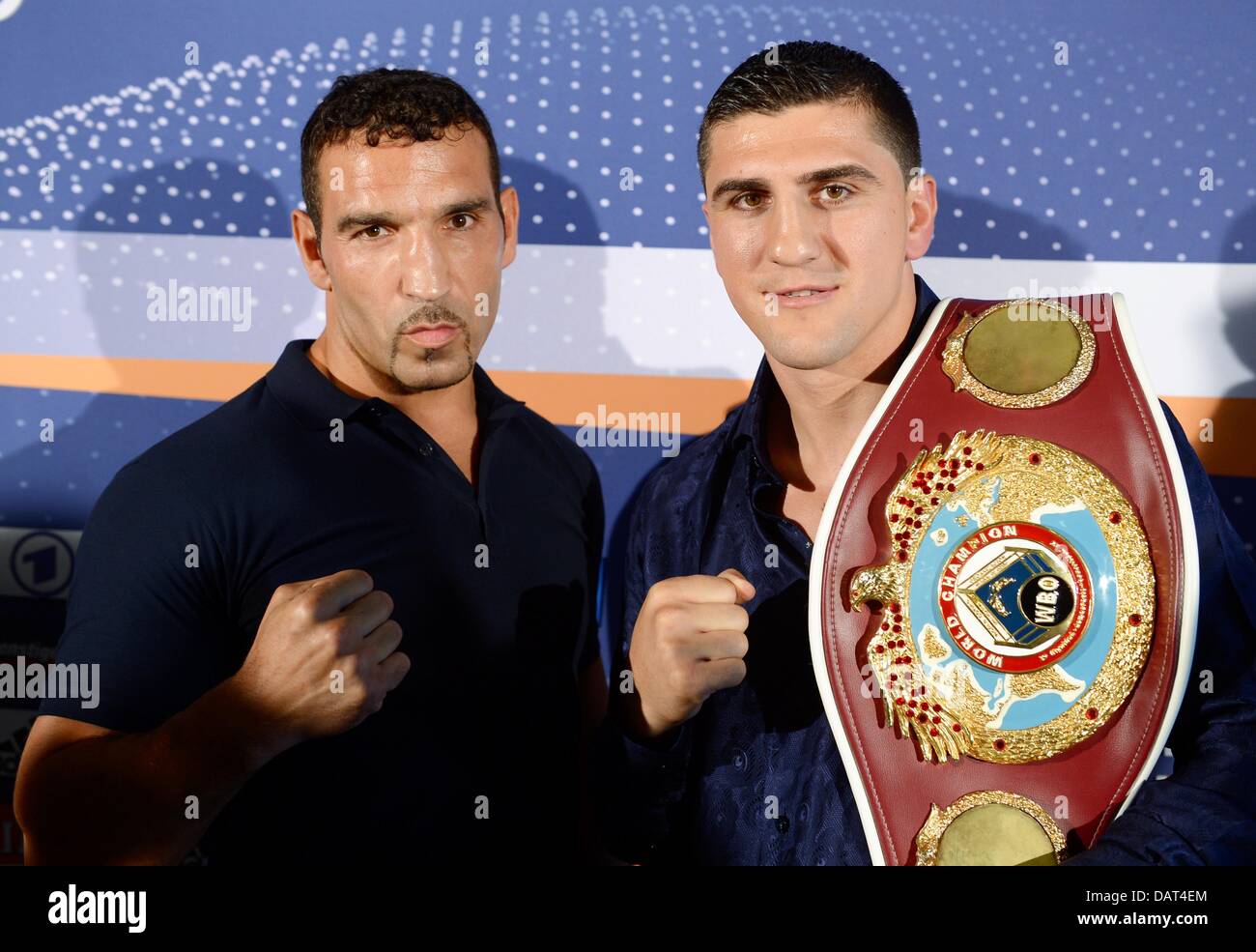 German professional boxers Firat Arslan (L) and Marco Huck (R) stand during a press conference in Schleyer Hall in Stuttgart, Germany, 18 July 2013. Marco Huck will defend his WBO world cruiserweight championship against Firat Arslan on 14 September. Photo: BERND WEISSBROD Stock Photo