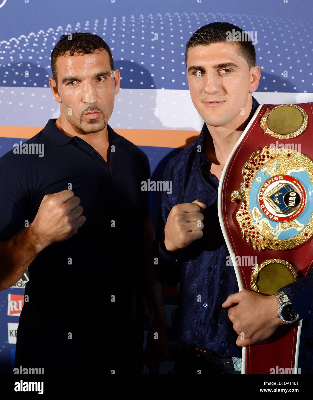 German professional boxers Firat Arslan (L) and Marco Huck (R) stand during a press conference in Schleyer Hall in Stuttgart, Germany, 18 July 2013. Marco Huck will defend his WBO world cruiserweight championship against Firat Arslan on 14 September. Photo: BERND WEISSBROD Stock Photo