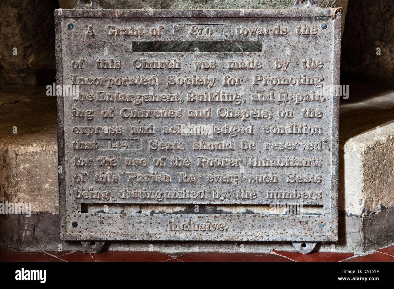 An old  plaque recording a charitable donation to reserve seats for poor parishioners, in the 15c St Stephen's Church, Old Radnor, Powys, Wales, UK Stock Photo