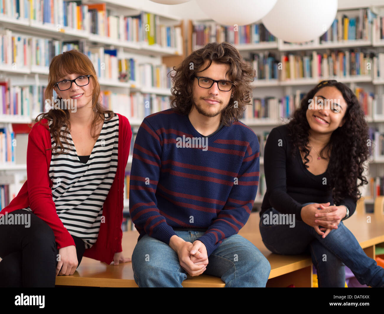 Group of multi ethnic people in library Stock Photo