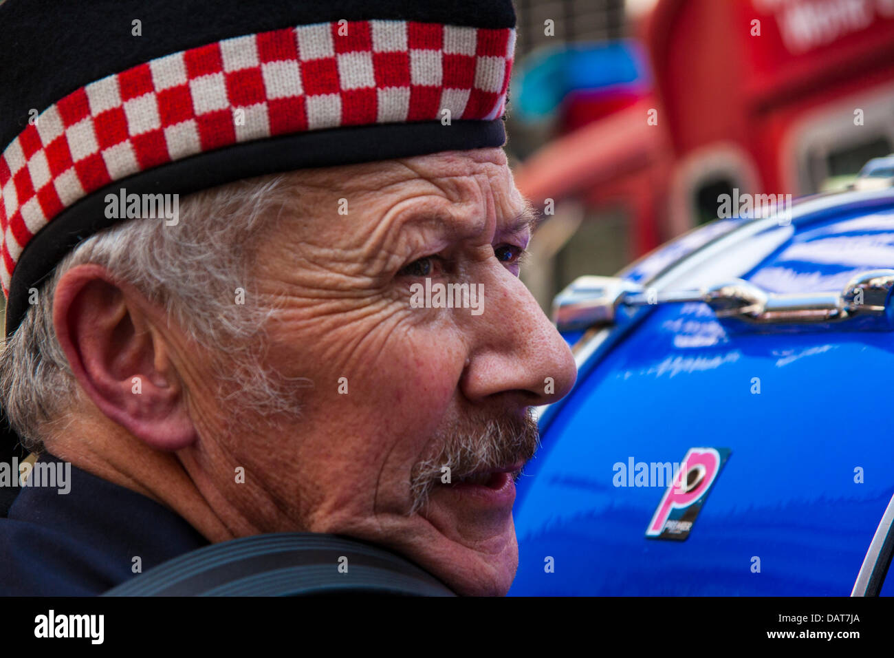 London, UK. 18th July 2013.  A drummer from the pipe band who led London Firefightersd in their protest march against cuts to the service. Credit:  Paul Davey/Alamy Live News Stock Photo
