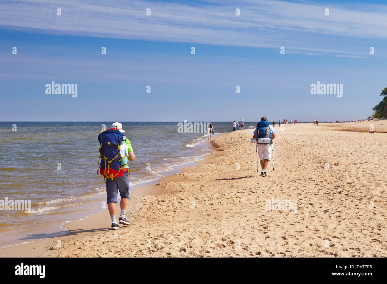Tourists wandering along the beach, Baltic Sea, Poland Stock Photo