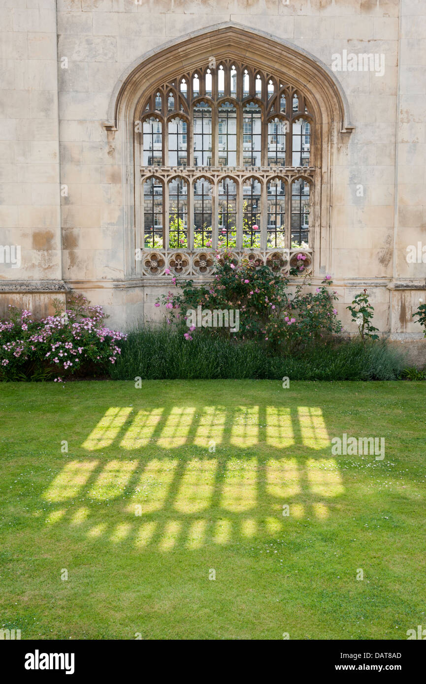 Sunlight streaming through an old stone window at King's College Cambridge UK Stock Photo