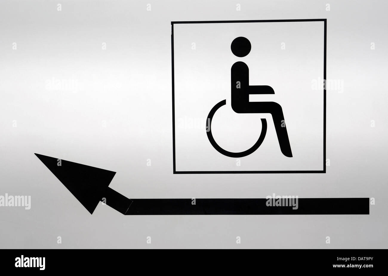 Disabled icon with a pointing arrow Stock Photo - Alamy