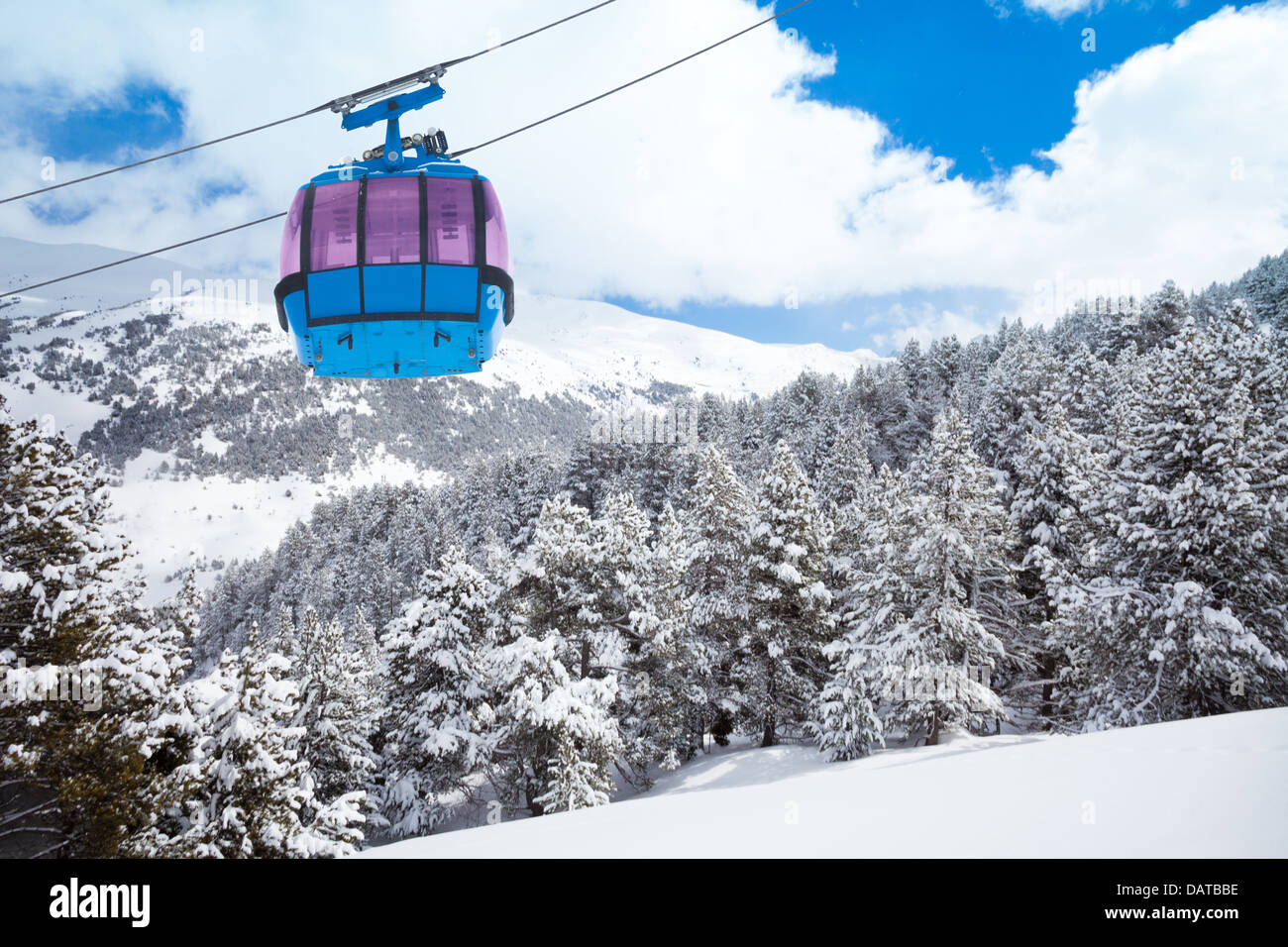Closeup of ski lift cable car and forest covered with snow on the ...