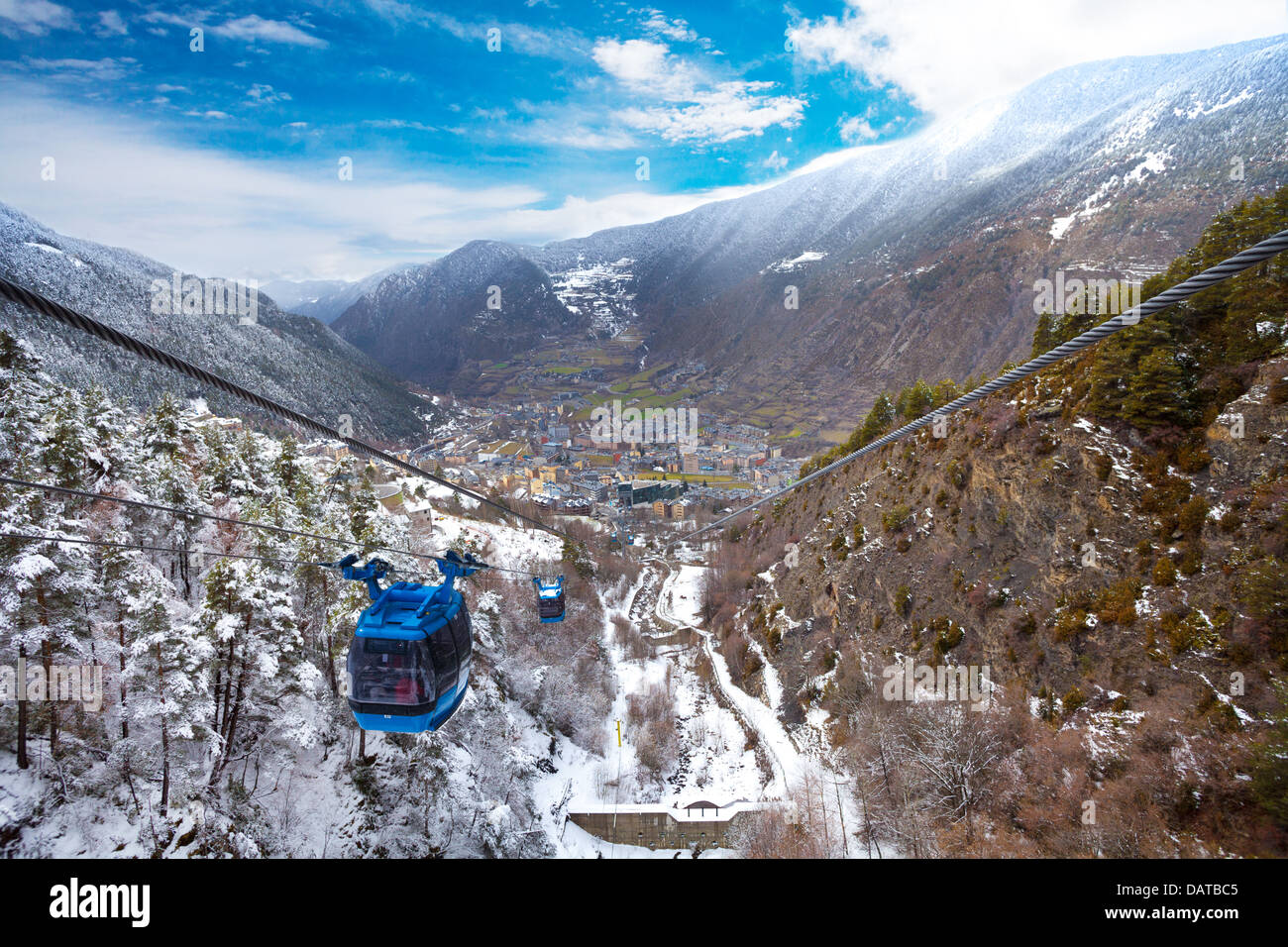 Encamp town in Andorra and cable car for lifting skiers and snowboarders to the top of the mountain Stock Photo