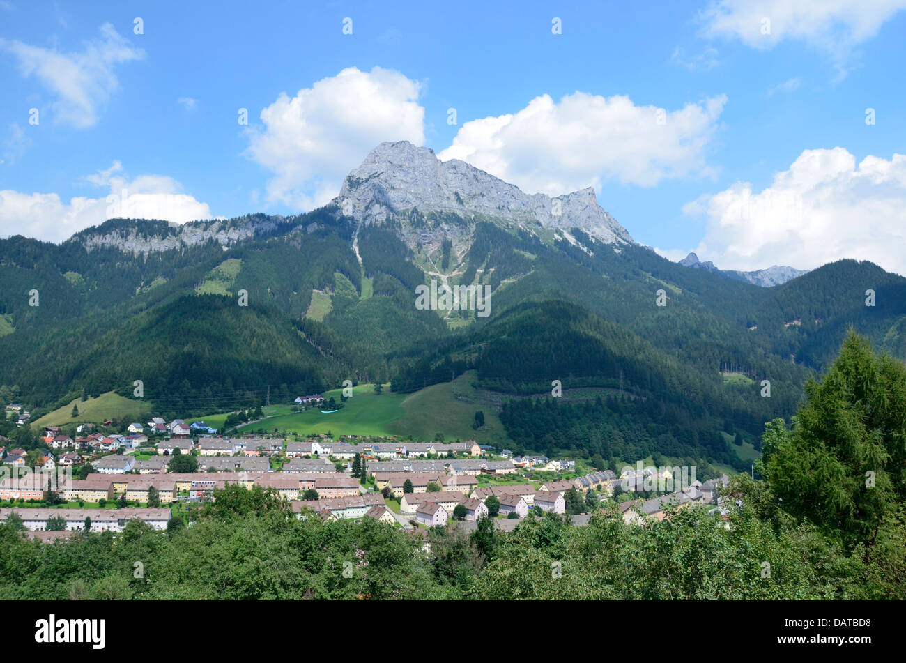 The miners' houses of Eisenerz at the the foot of Vordernberg, Styria, Austria, contrast a lot to agricultural sourroundings. Stock Photo