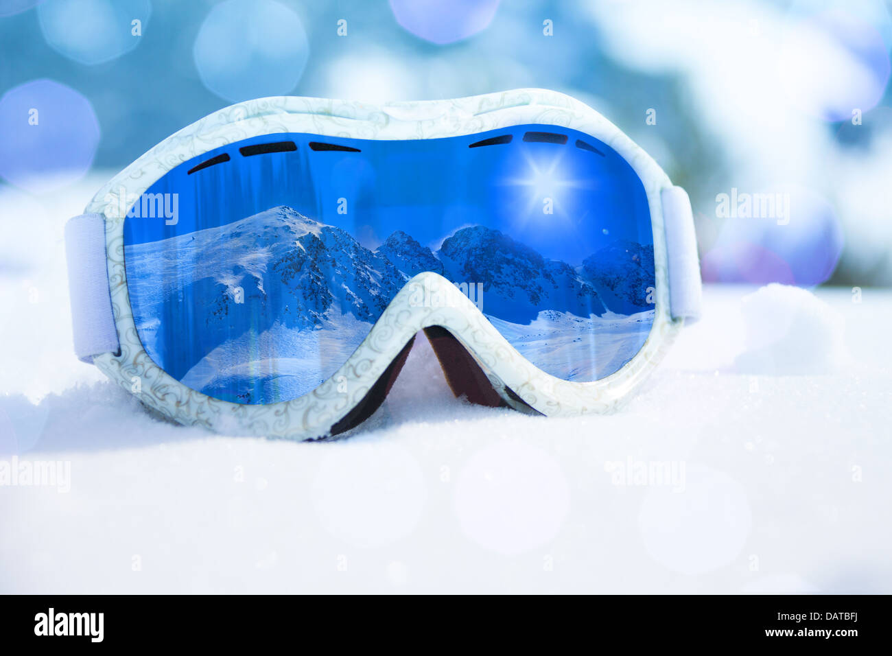 Close-up of ski and snowboard mask with mountain reflection in it Stock Photo