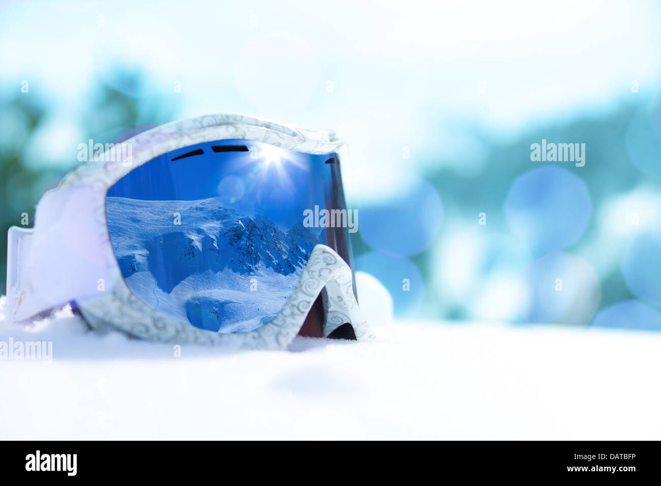 Close-up of ski and snowboard mask with mountain reflection in it, side view Stock Photo