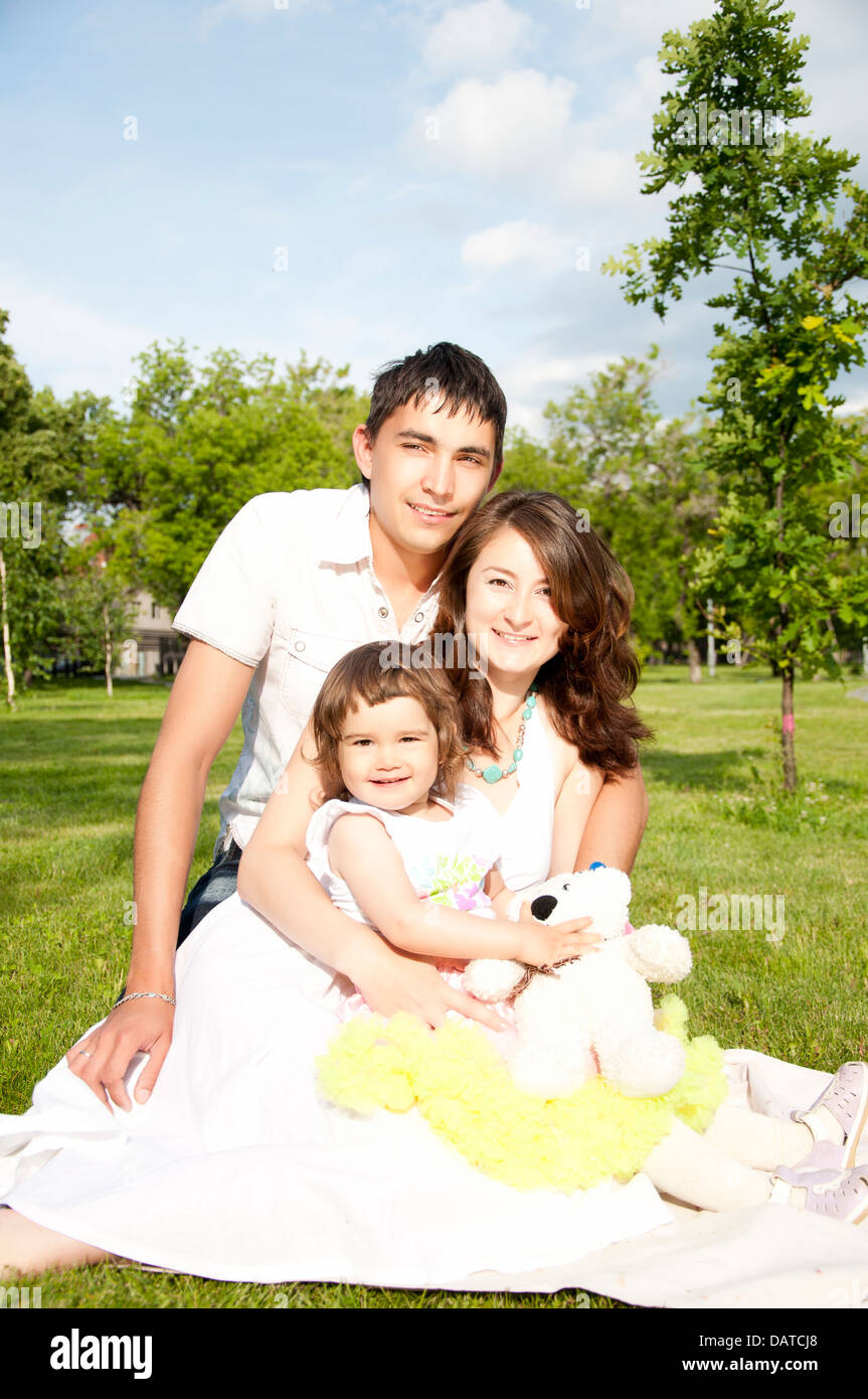 The family has a rest in park Stock Photo - Alamy