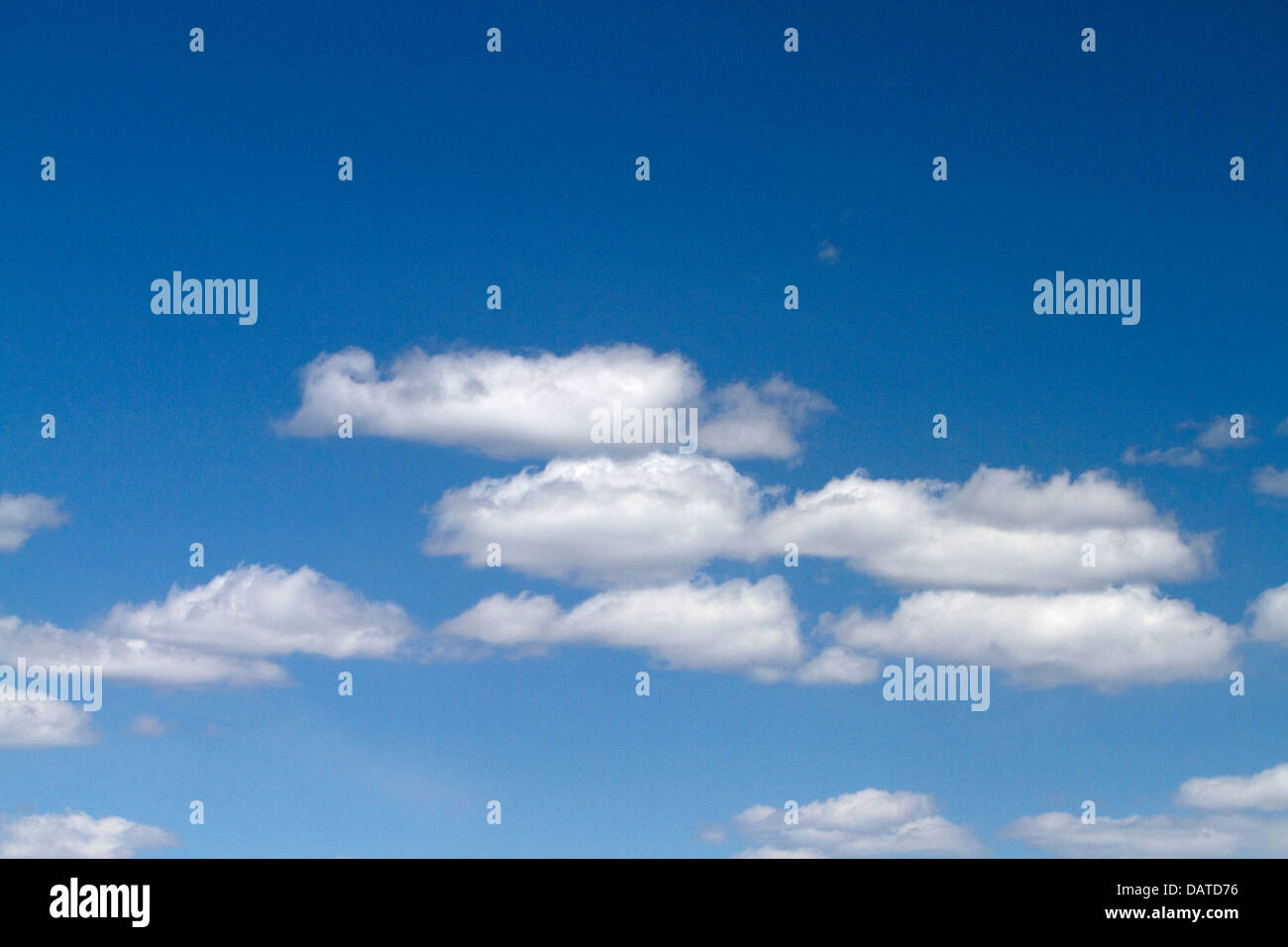 Cumulus clouds in a blue sky. Stock Photo