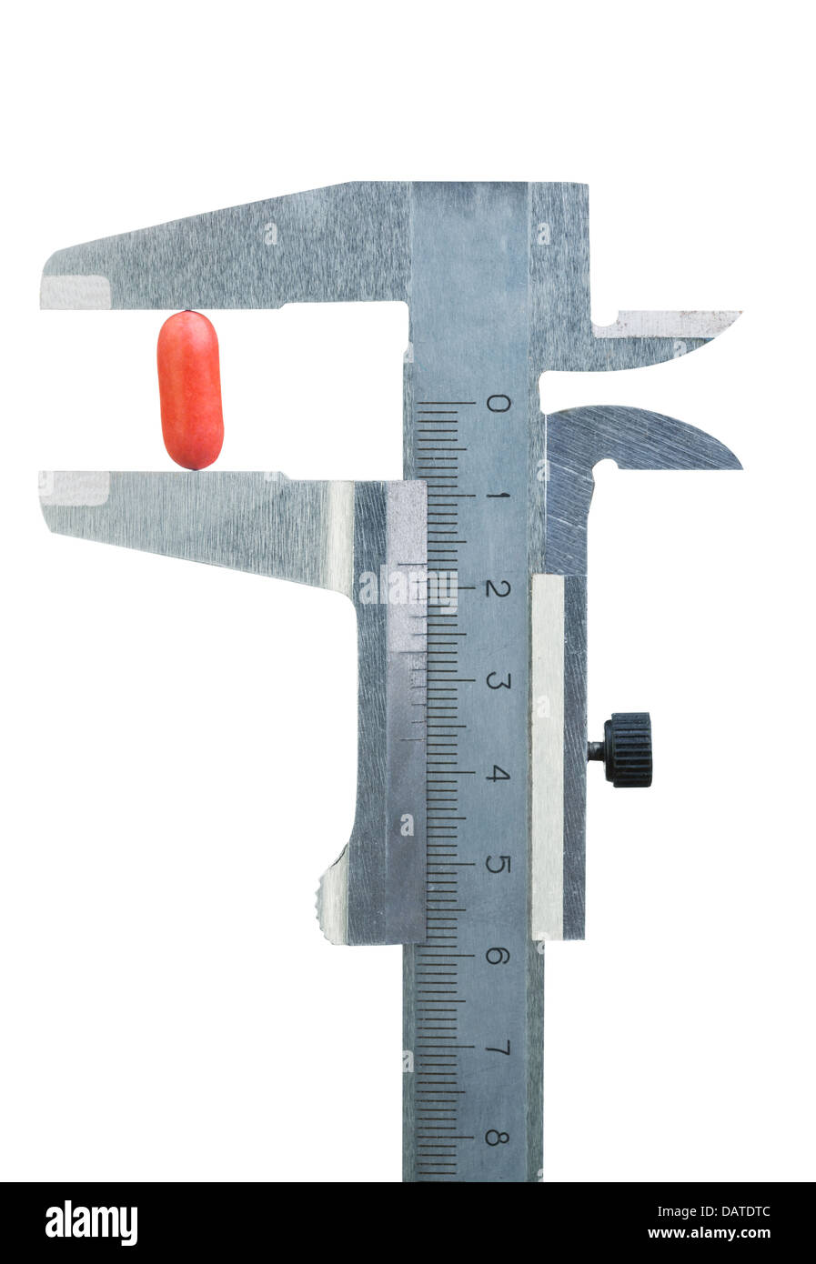 Caliper measures size of red pill, isolated on white Stock Photo