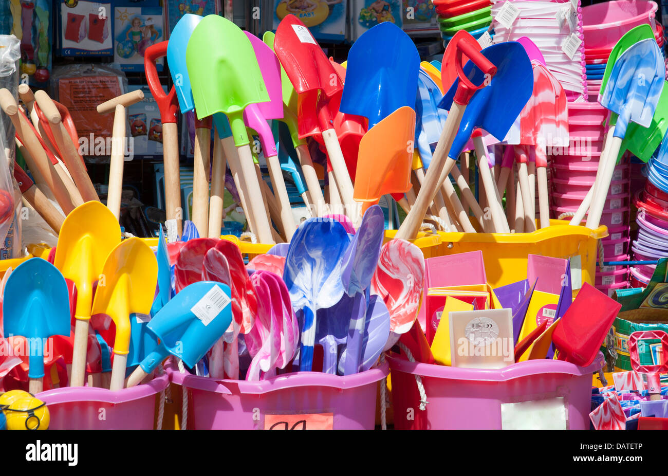 Children's spades and buckets on sale at the seaside Stock Photo Alamy
