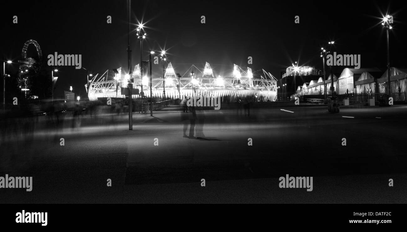The Olympic Stadium, London, illuminated at night Stock Photo