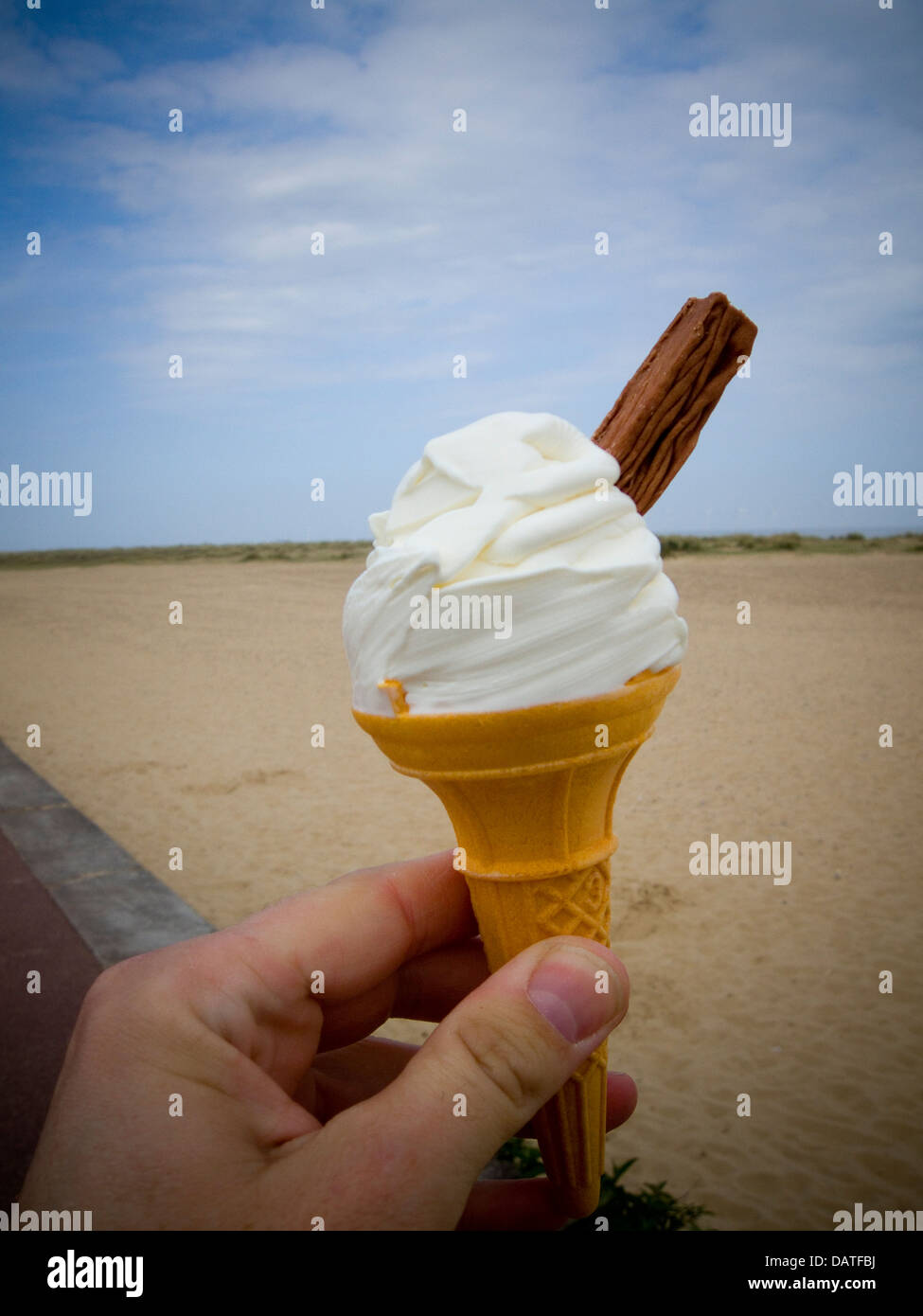 Ice Cream cone with chocolate flake by the seaside Stock Photo Alamy
