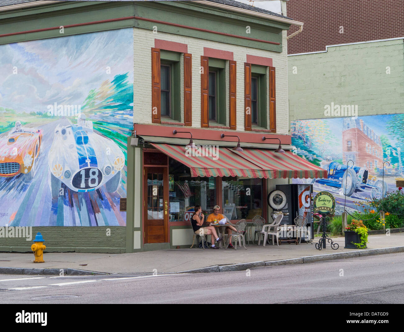 Painted murals on buildings on Franklin Street in Watkins Glen New York in the Finger Lakes Region of NY State Stock Photo