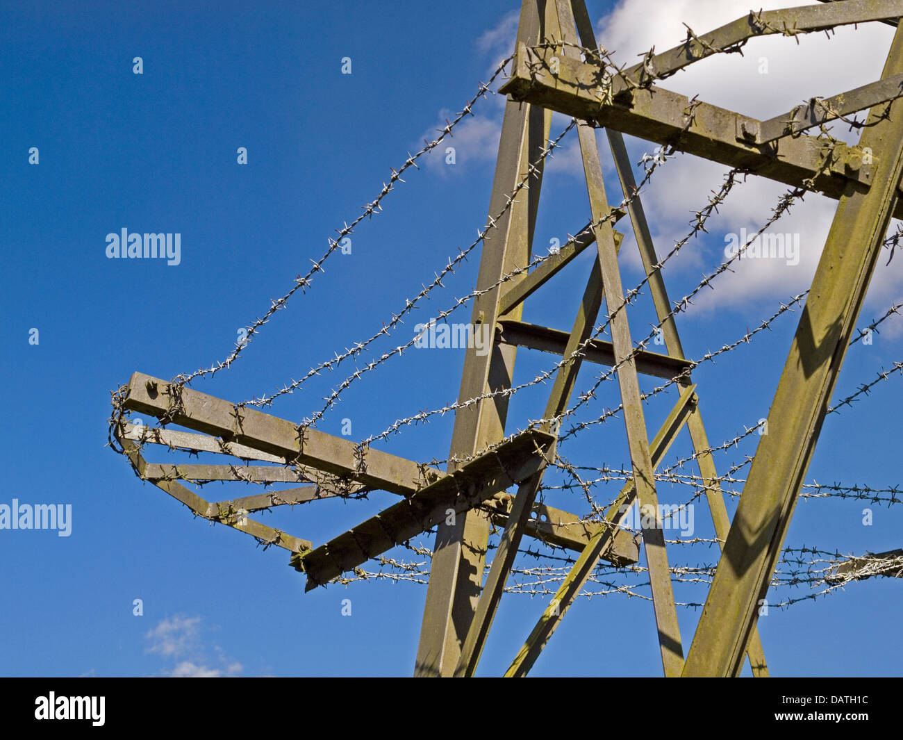 barbed wire around a pylon Stock Photo
