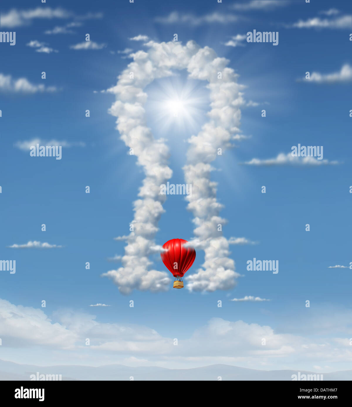 Finding the answer with a group of clouds in the sky in the shape of a key hole as a business concept with a red hot air balloon flying up towards the glowing sun target as an icon of ideas and inspiration. Stock Photo