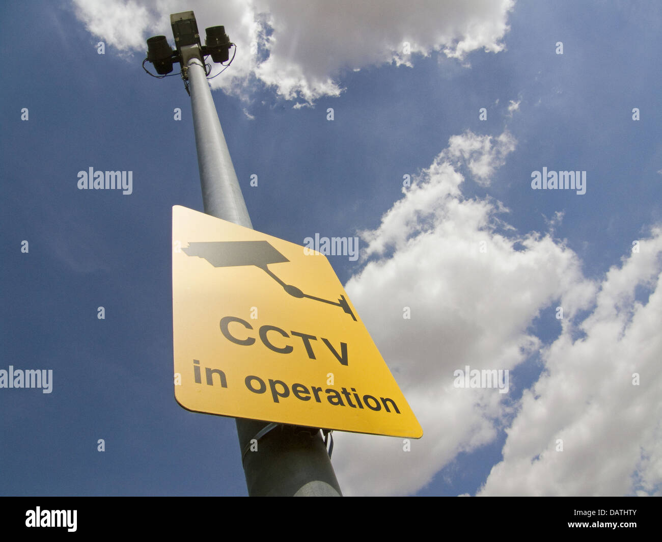 Cctv Sign And Camera On Pole Dramatic Blue Sky With Clouds Stock Photo Alamy