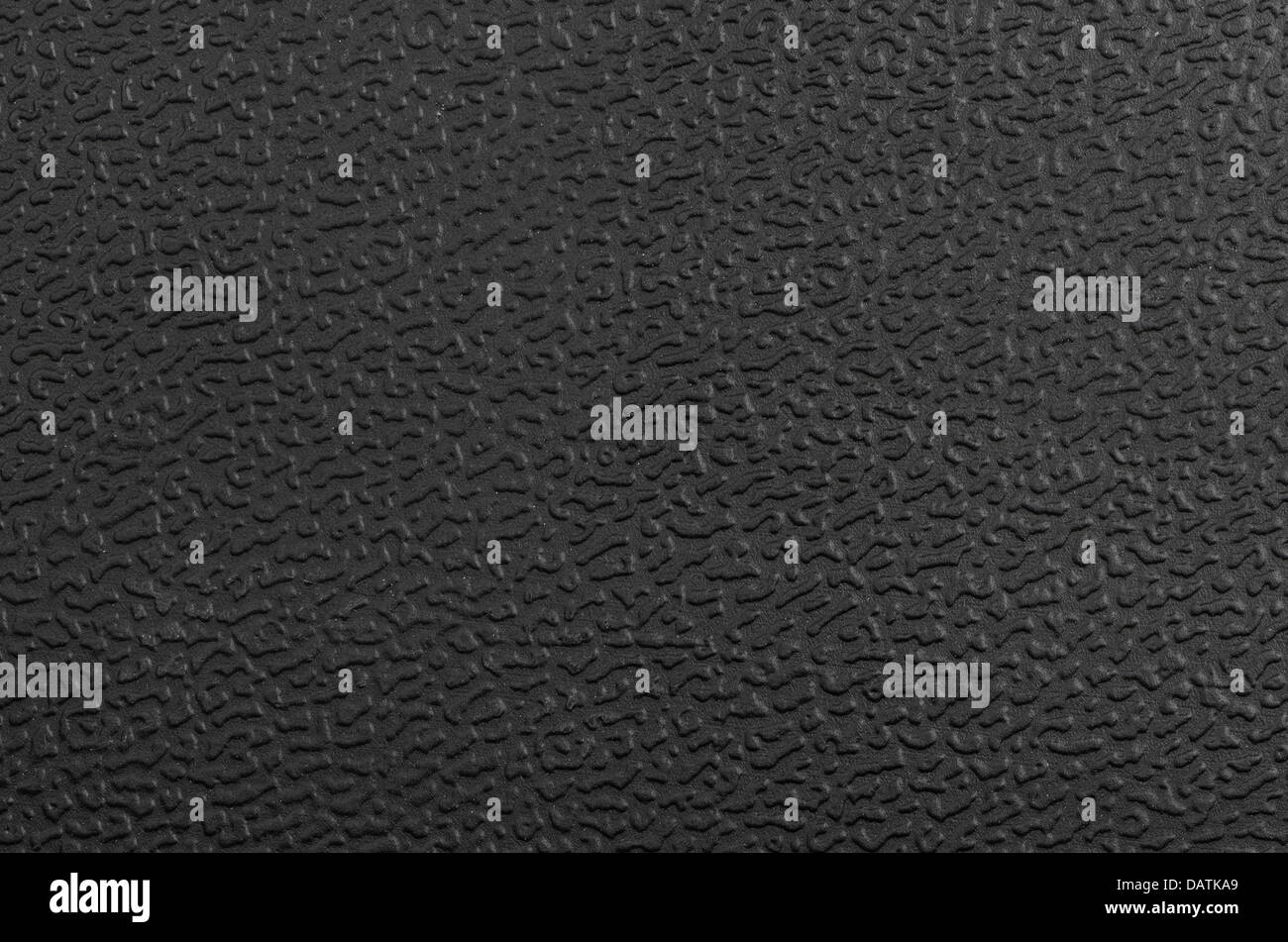 Closeup of black plastic surface texture. Stock Photo