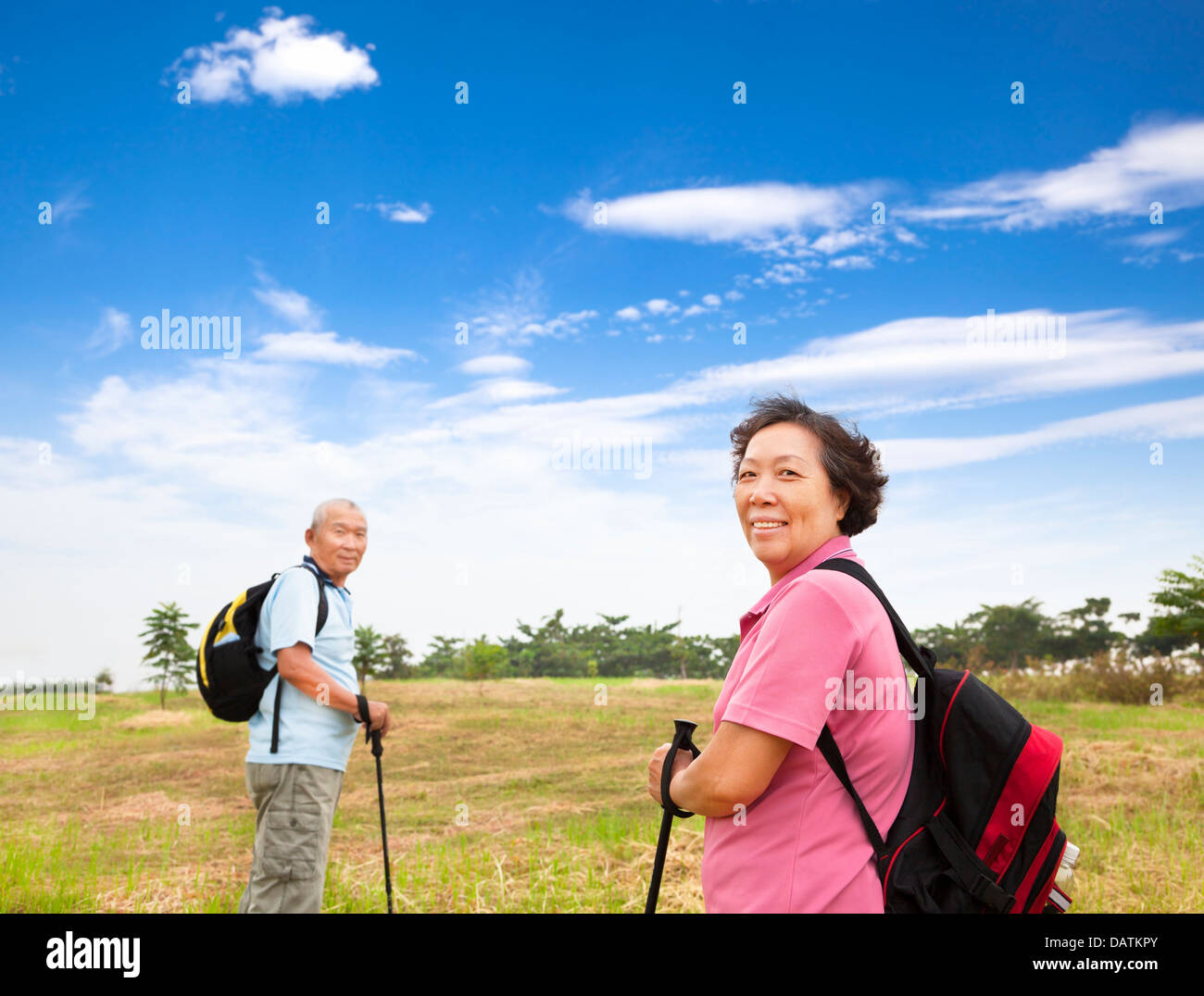 happy asian senior couple hiking in the nature Stock Photo - Alamy