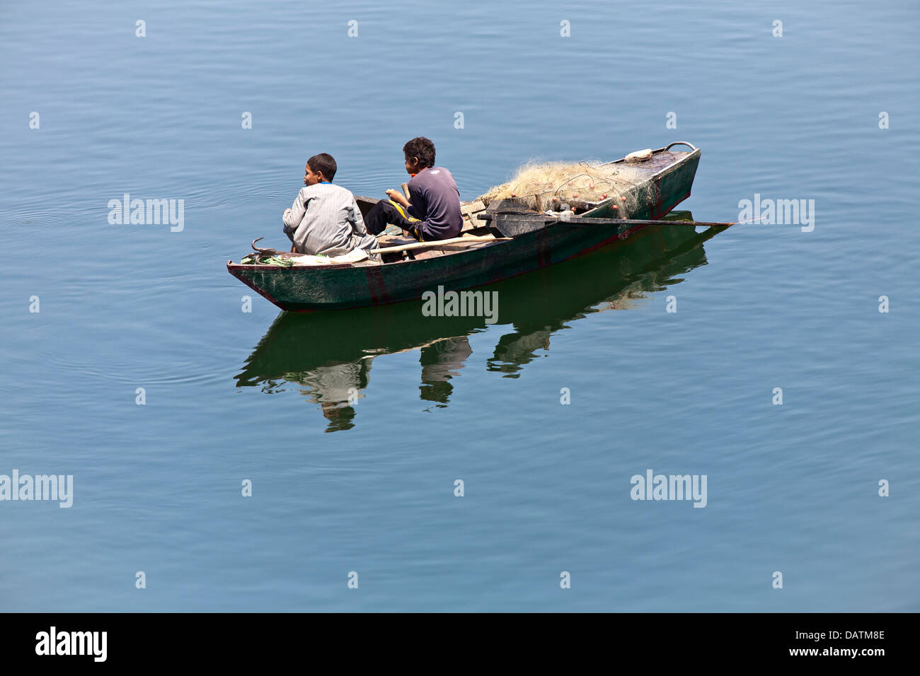 Boys in water with boat hi-res stock photography and images - Alamy