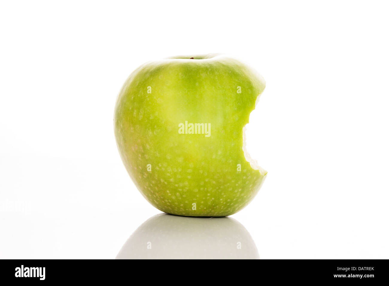 bitten green apple on a white background Stock Photo