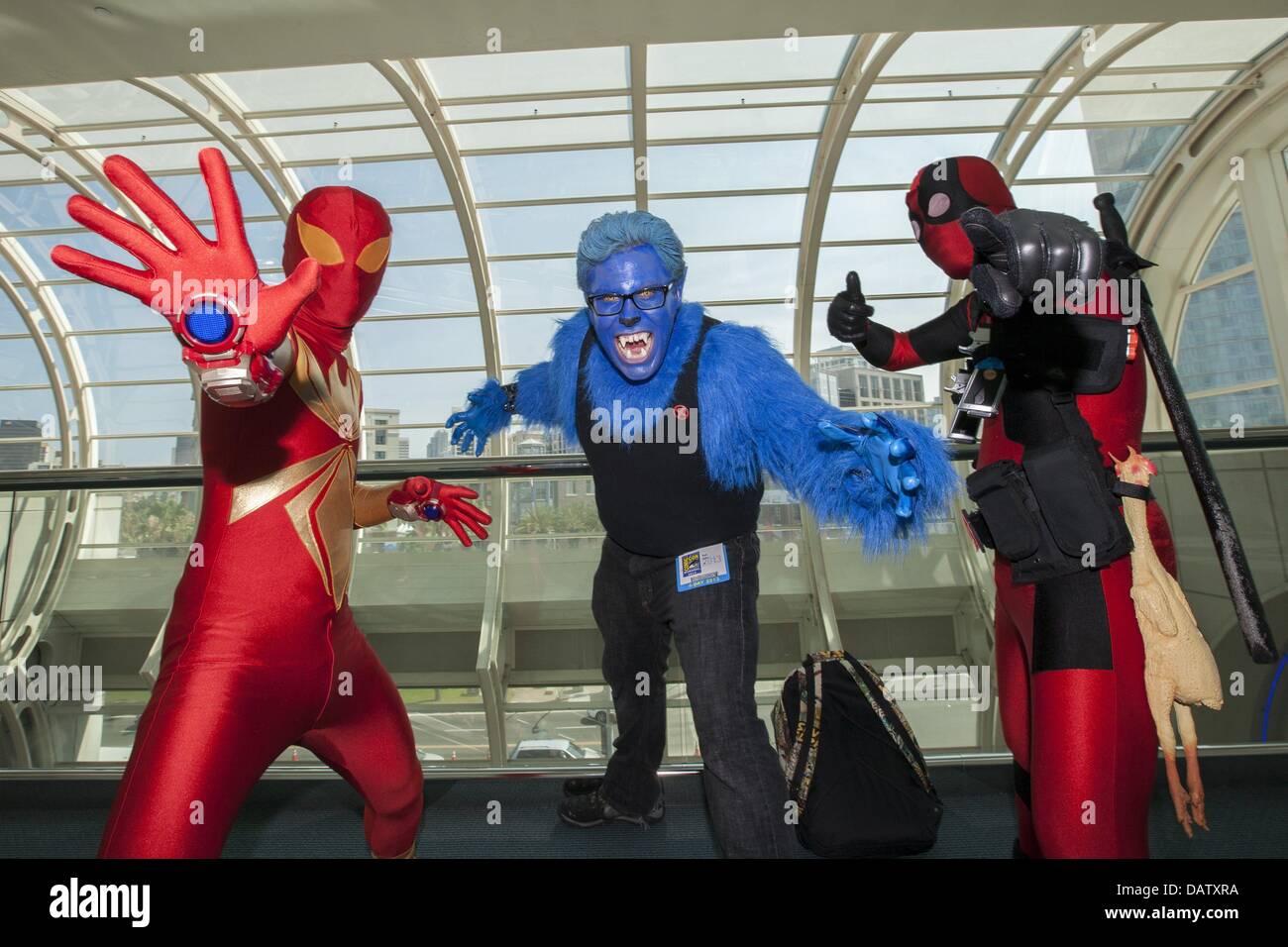 San Diego, California, USA. 18th July, 2013. Rancho Cucamonga residents KEVIN JUSTINIANO, BRETT USHER, and West Covina resident JOHN JUSTINIANO dress as their favorite comic book characters during the annual Comic-Con International in San Diego, California. Credit:  Daniel Knighton/ZUMAPRESS.com/Alamy Live News Stock Photo
