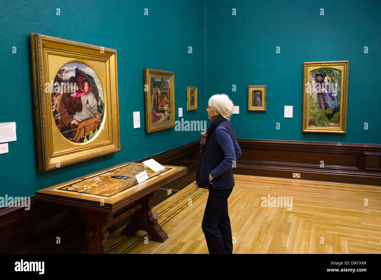 UK, England, Birmingham, Art Galley & Museum, visitor looking at Ford Madox Brown’s ‘The Last of England’ Stock Photo