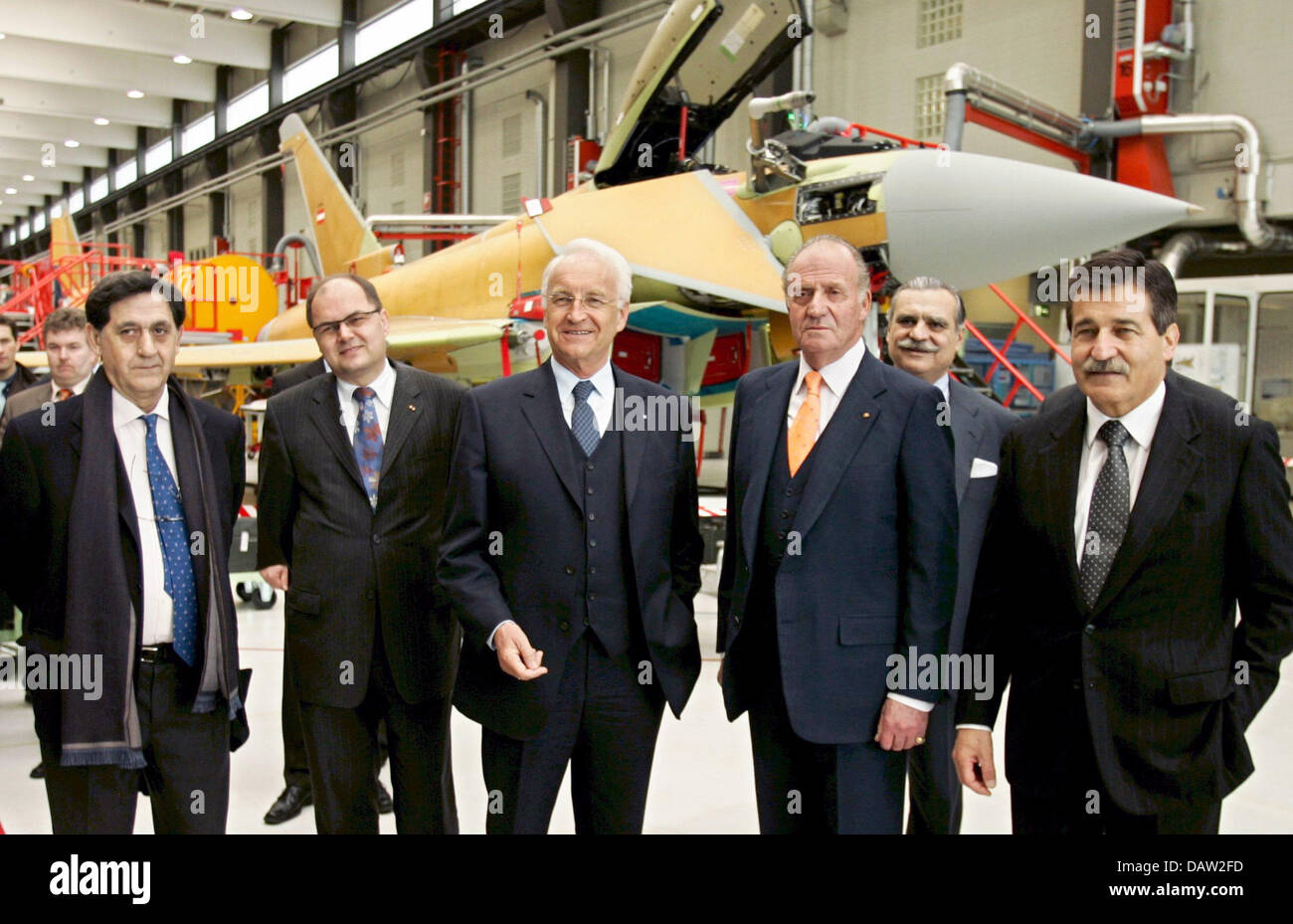 Juan Carlos I., King of Spain (2. R), Bavarian Prime Minister Edmund Stoiber (3. R) and EADS administrative director Manfred Bischoff (R) pose in front of an Eurofighter jet at the military aeronatutic centre in Manching, Germany, Wednesday, 07 February 2007. The King of Spain informed himself about technological developments of aircraft construction at the European Aeronautic Defe Stock Photo