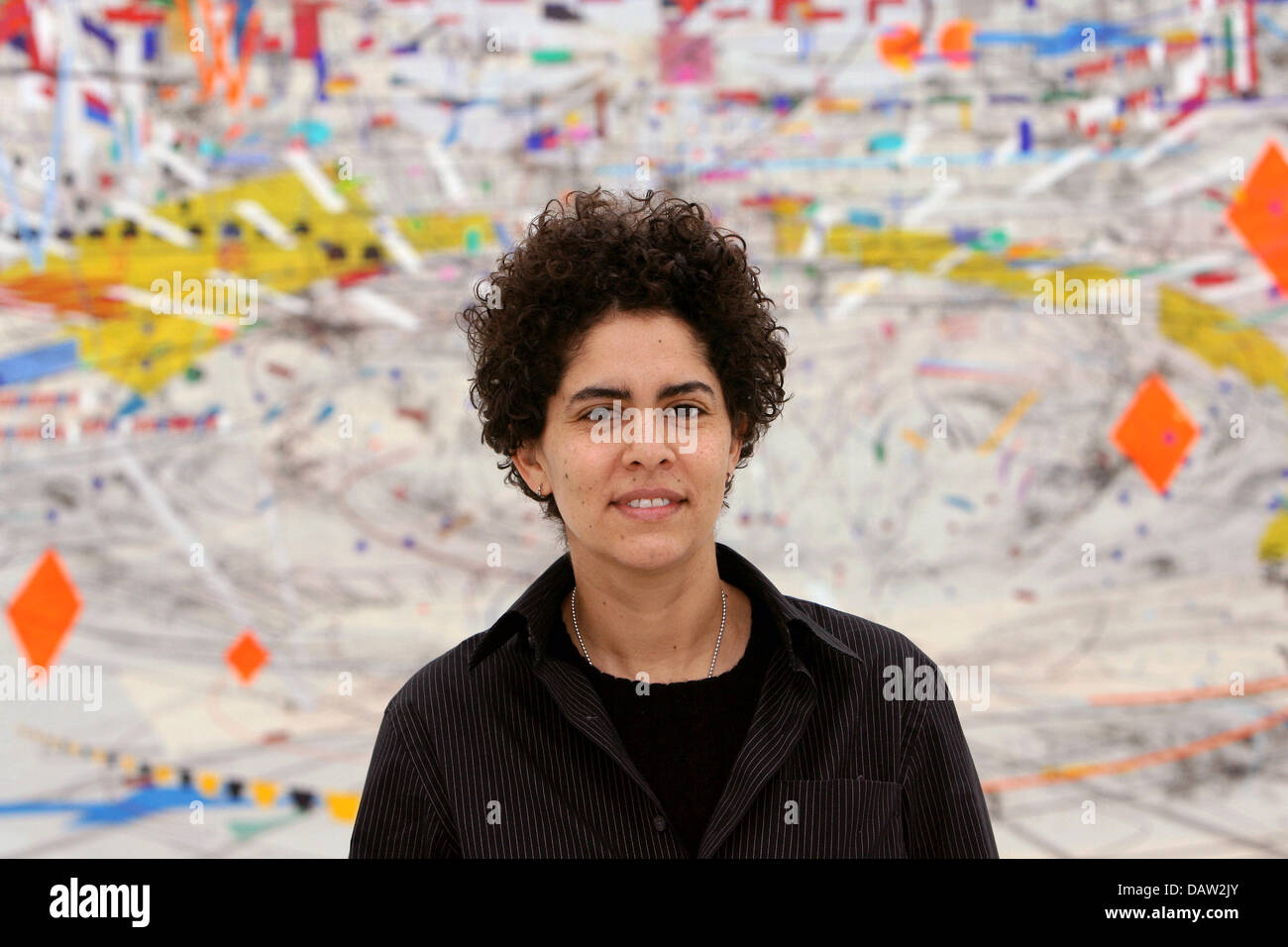Ethiopian artist Julie Mehretu poses in front of her artwork at the Art