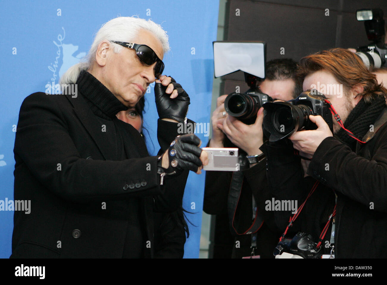 German fashion designer Karl Lagerfeld is pictured holding his camera  during a photo call for the film 'Lagerfeld Confidential' at the 57th  Berlinale Film Festival in Berlin, Germany, Saturday, 10 February 2007.