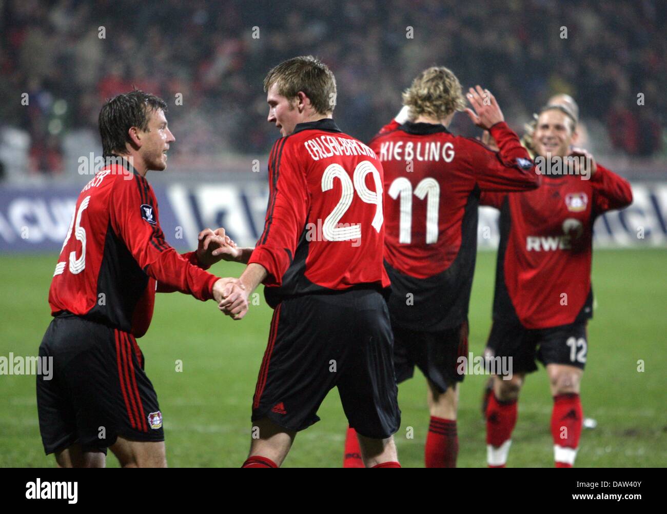 Leverkusen's Bernd Schneider, Jan Ingwer Callsen-Bracker, Stefan Kießling and Andrey Voronin (L-R) celebrate the 1-0 score during the UEFA Cup round of the last 32 match Bayer Leverkusen vs Blackburn Rovers at BayArena in Leverkusen, Germany, Wednesday, 14 February 2007. Photo: Oliver Berg Stock Photo