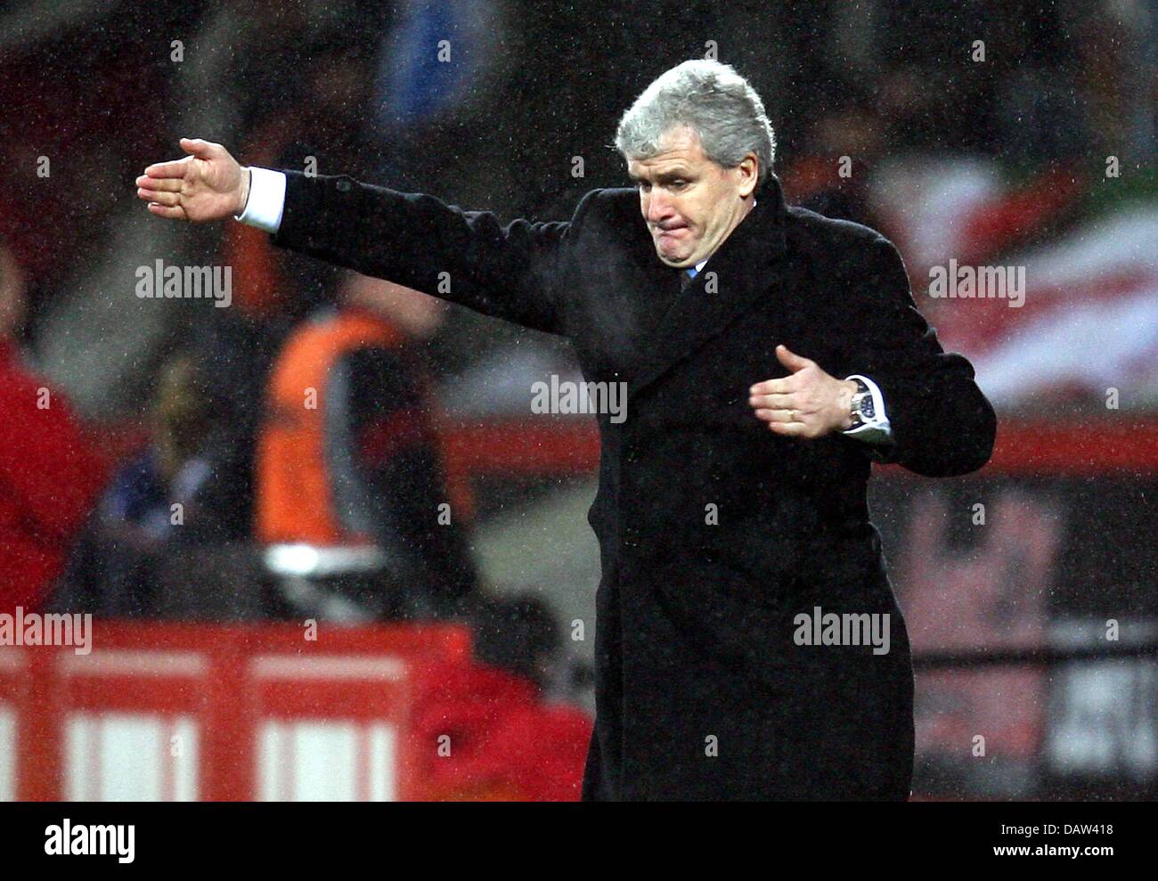 Blackburn's head coach Mark Hughes makes a gesture at the sideline