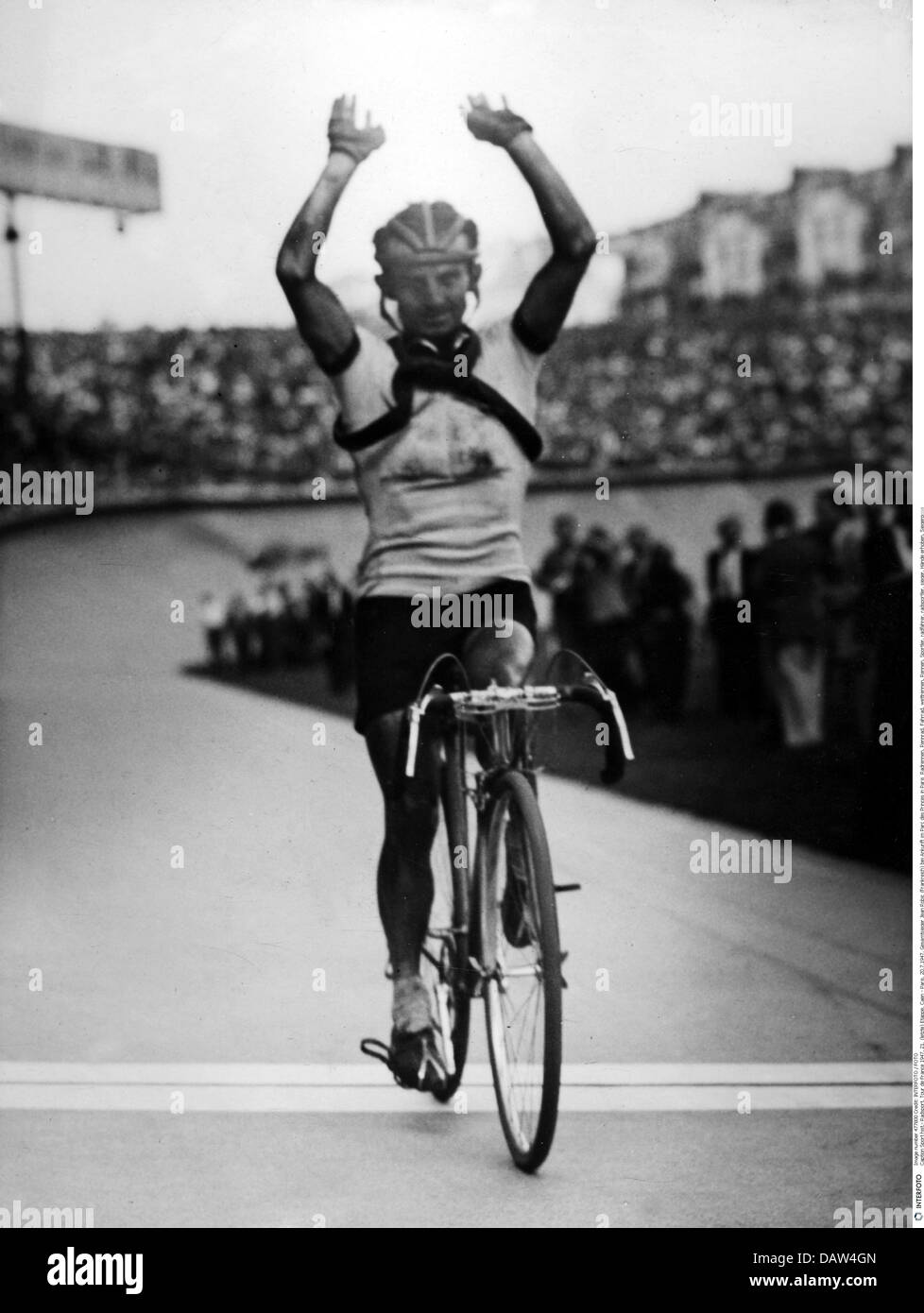 sports, cycling, Tour de France, 1947, 21th stage, Caen - Paris, 20.7.1947, complete winner Jean Robic (France), arriving at Parc des Princes, Paris, 1940s, 40s, 20th century, historic, historical, cycle race, cycle races, racing cycle, racer, road bike, racing cycles, racers, road bikes, athlete, sportsman, cyclist, bikerider, bicyclist, cyclists, bikeriders, bicyclists, winning, handsign, hands, rising, hand sign, gesture, gestures, gesticulation, body language, arms, finish, cross the finishing line, people, Additional-Rights-Clearences-Not Available Stock Photo
