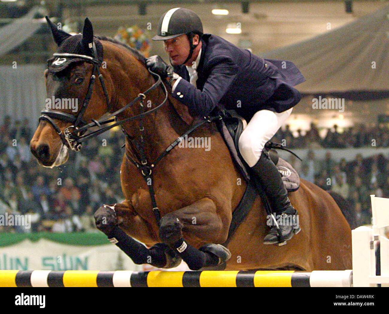 Show jumper Thomas Voss is pictured in action on his horse Leonardo at the Grand prix of Neumuenster, Germany, Sunday 18 February 2007. The 48 year-old rider won the competition.  Photo: Ulrich Perrey Stock Photo