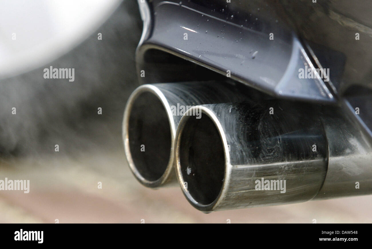 Exhaust fumes emerge from a double exhaust pipe of a car in Lichtenfels